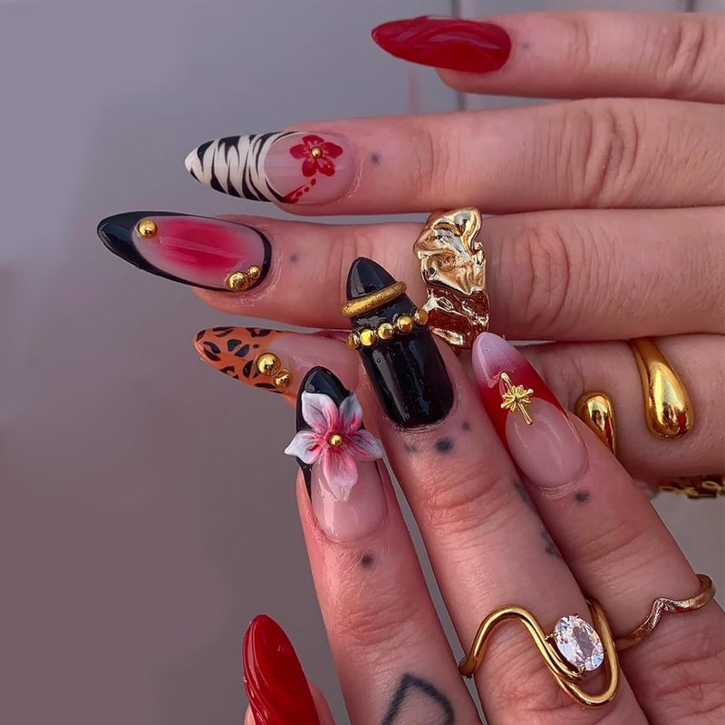 SEENEEY Almond Press on Nails Long Fake Nails Red Artificial Nail Black French Pink Floral and Gold Charm Designs Cute Stick on Nail for Women 24pcs - Image 1